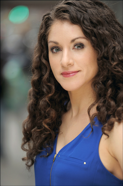 hazeleyes庆怜,hazeleyes a blue vest, has light skin, curly brown hair and hazel eyes